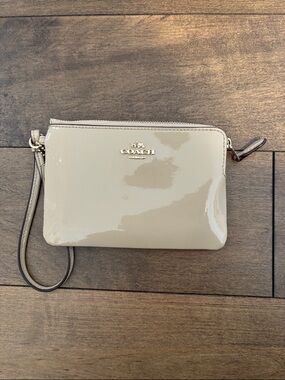 Coach Patent Leather Wristlet in Taupe Beige with Gold Logo